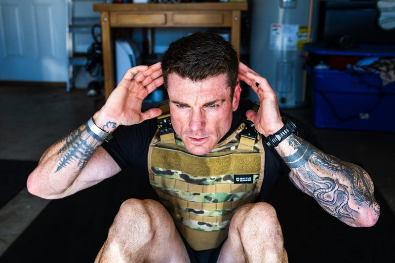 Dan Fahey of Gritty Soldier doing weighted vest sit-ups