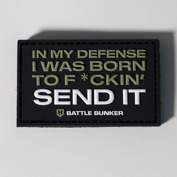 Black Battle Bunker patch with bold text 'IN MY DEFENSE I WAS BORN TO F*CKIN' SEND IT' in military green and white