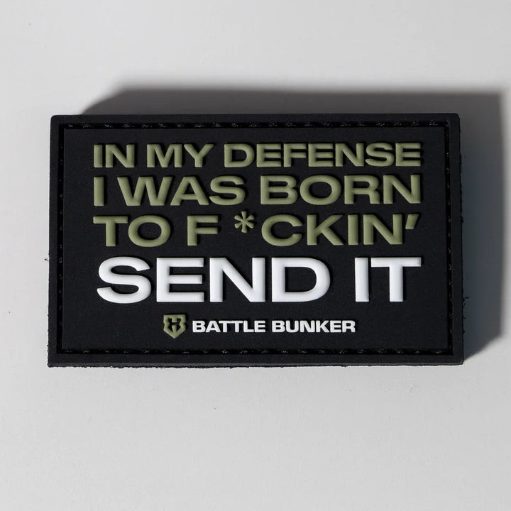 Black Battle Bunker patch with bold text 'IN MY DEFENSE I WAS BORN TO F*CKIN' SEND IT' in military green and white