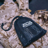 Black mesh pouch labeled Battle Straps by Battle Bunker on digital camo tactical gear