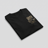 A folded black t-shirt with a distressed brown graphic on the left chest, displayed on a neutral light gray background.
