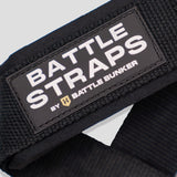Close-up of black Battle Straps by Battle Bunker with stitched logo patch on textured fabric