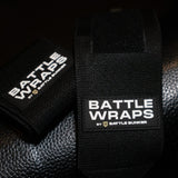 Black Battle Wraps wrist straps by Battle Bunker on textured surface