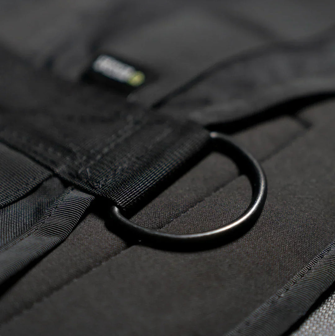 Close-up of black fabric strap with metal D-ring on Battle Bunker tactical gear