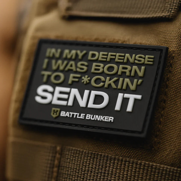 Close-up of Battle Bunker tactical vest patch with bold text: In my defense I was born to f*ckin' send it