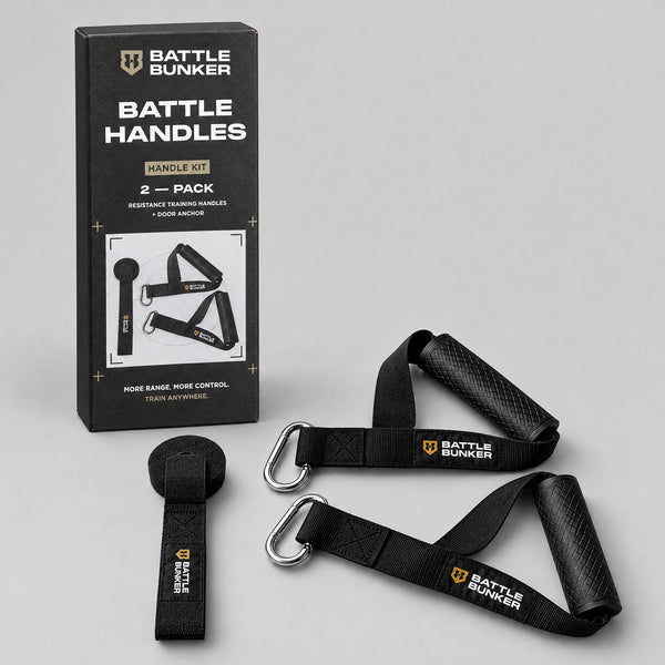 Battle Handles kit contents: two resistance band handles with textured rubber grips, nylon straps and steel carabiners, plus a door anchor, in front of the Battle Bunker box