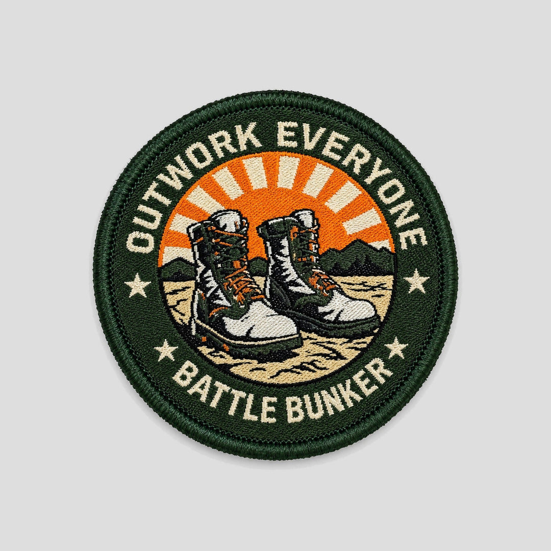 Outwork Everyone Patch, round green patch with combat boots and orange sunburst