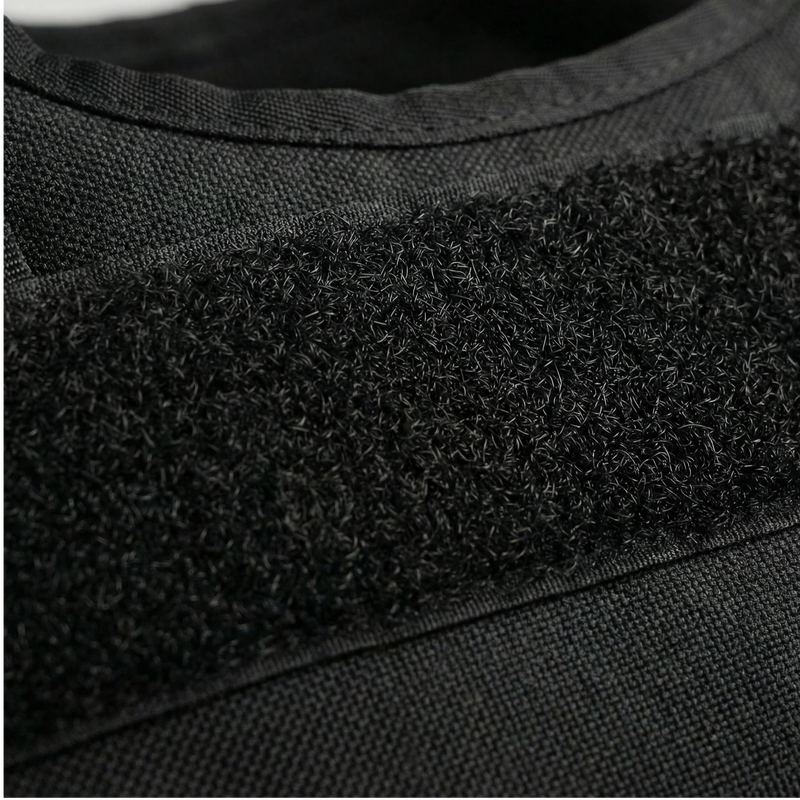 Close-up of a textured black band on a gray fabric background