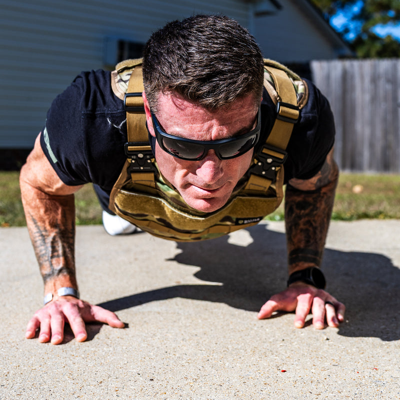 Dan Fahey of Gritty Soldier doing weighted vest push-ups in the Battle Bunker Hybrid Weight Vest MK2 camo