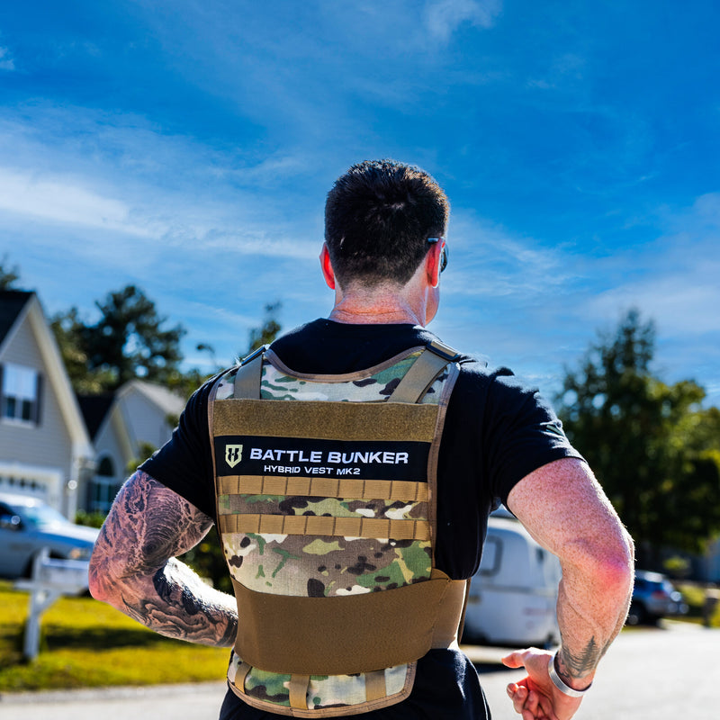 Back of the Battle Bunker Hybrid Weight Vest MK2 camo with its Hybrid Vest MK2 patch, worn by Dan Fahey of Gritty Soldier