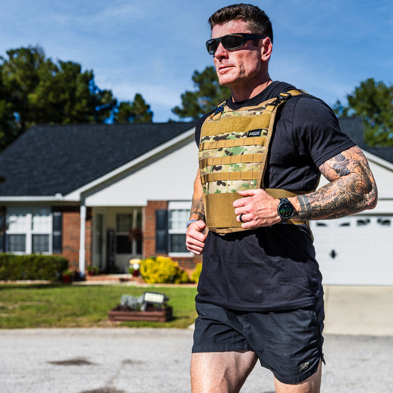 Dan Fahey of Gritty Soldier running in the Battle Bunker Hybrid Weight Vest MK2 camo