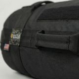battle bunker Black tactical bag with 'Battle Bunker' logo on a light gray background